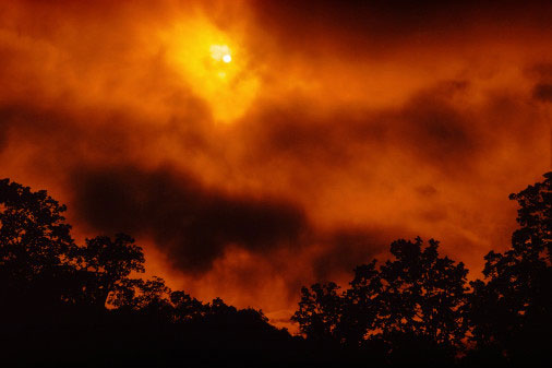 fire-dimmed sun